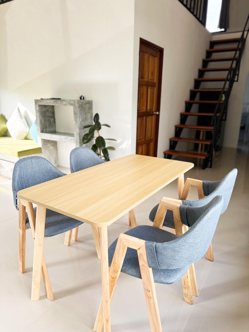 Dining table for four next to the stairs