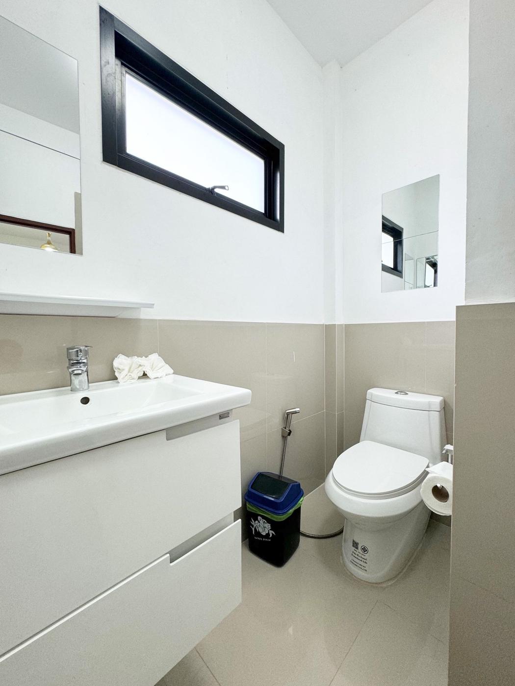 Bathroom with vanity and window